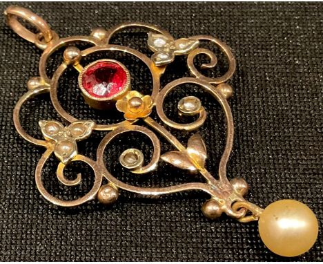 A 9ct gold Art Nouveau pearl and garnet set pendant 