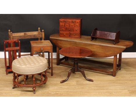 A mahogany drop-leaf coffee table, 53.5cm high, 149cm long, 46cm opening to 91cm wide; a circular stool; a low tripod occasio