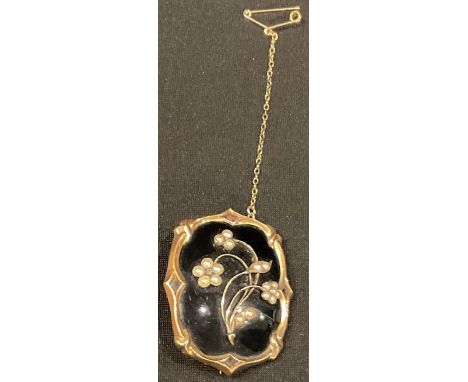 A Victorian gold mounted mourning brooch,  black onyx and seed pearl, set with a waxed lock of hair adorned with seed pearls,