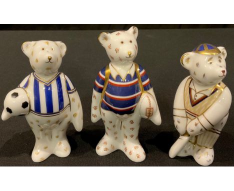 A Royal Crown Derby Teddy Bear model, Rugby Bear, 9cm, printed mark, boxed; two others, Football Bear and Cricket Bear, all b