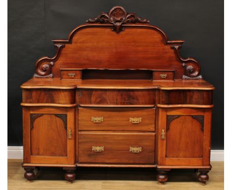 A Victorian mahogany chiffonier or sideboard, shaped half-gallery carved and applied with acanthus above a shelf and two smal