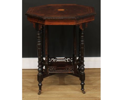 A late Victorian rosewood and simulated rosewood centre table, octagonal top inlaid with a circular batwing patera and outlin