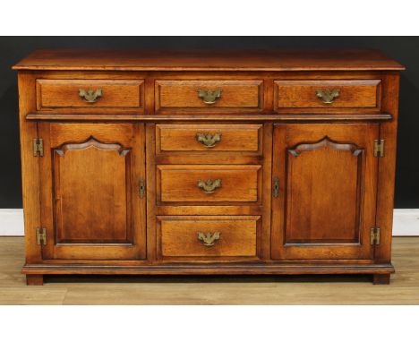 A George III style oak low dresser, possibly Titchmarsh &amp; Goodwin, rectangular top above an arrangement of drawers and a 