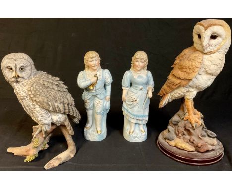 A Country Artists model of an owl, Great Grey Owl with White Pine Cones, 03735, 27cm; a Leonardo resin model of a Bran Owl, i