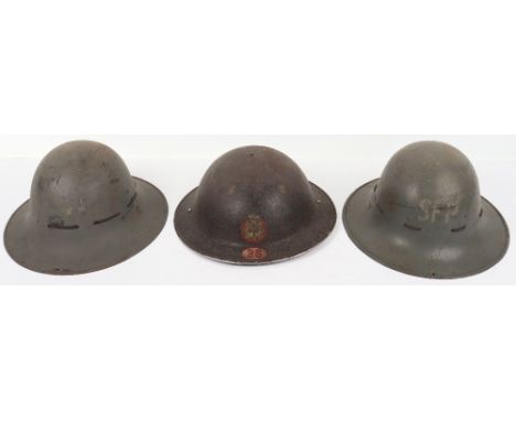 WW2 British Helmets: Two home front helmets both with liners one has SFP to front, other being British army steel helmet with