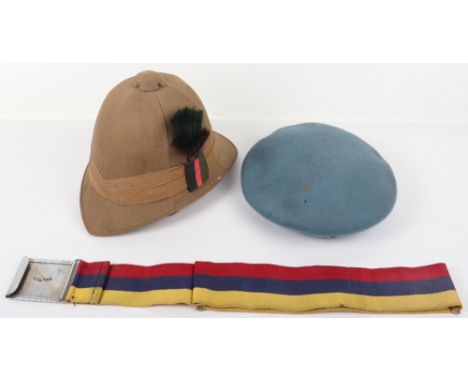 Military Headdress, consisting of United Nations beret with badge, modern made pith helmet with cloth pagri badge and Rhodesi