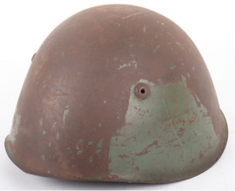 WW2 Italian Helmet: retains traces of original paint, complete with liner and chin strap. 