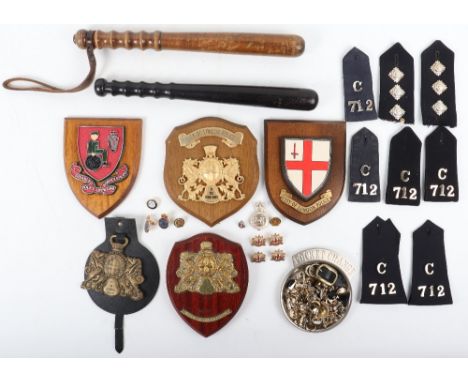 Three Obsolete City of London Police Plaques, one horse brass mounted on leather back, RUC plaque, two police truncheons (one