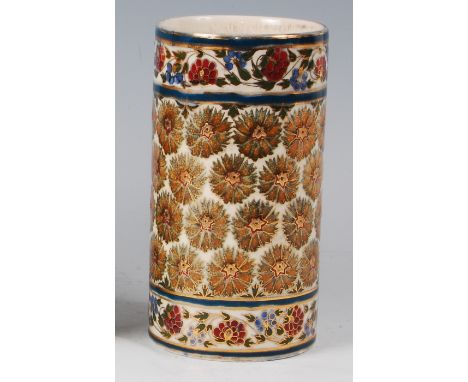 Zsolnay Pecs - a cylindrical pottery vase, underglaze painted with stylised flower heads and trailing floral borders, further