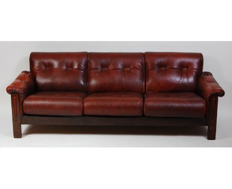 A 1970s Danish tan leather three-seater sofa, raised on plain oak supports, w.210cm. Stands well.Frame in good order.Slight f