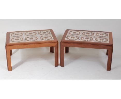 A pair of 1960s G-Plan teak and tile top inset low occasional tables, labelled verso, h.39cm, w.71.5cm, d.51.5cm