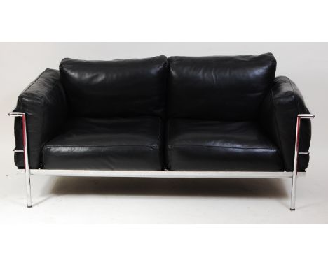 After Le Courbusier &amp; Charlotte Perriand - an LC2 tubular chrome framed two-seater sofa, having black leather cushions, o