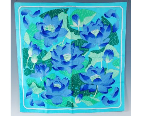 A Hermès of Paris silk scarf in the Fleurs de Lotus pattern, designed by Christiane Vauzelles, titled and further marker Herm