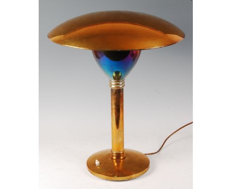 An American Art Deco brass table lamp, having integral domed shade, the plain column with concentric reeded upper and lower b