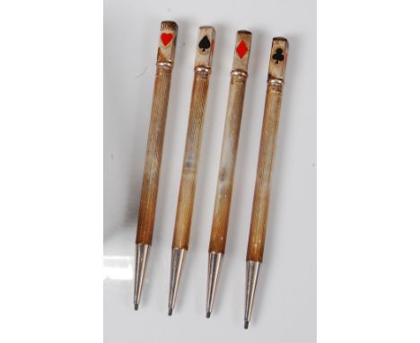 Four 1930s sterling silver propelling pencils, the terminals enamel decorated with one each of the four card suits, each stam