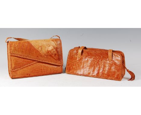 An early 20th century crocodile skin shoulder bag, of light tan colour, the edges with exposed cross-stitching, w.27cm; toget