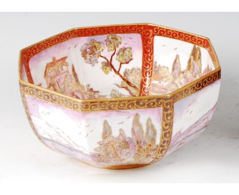 A 1930s Wedgwood lustre ceramic octagonal table bowl, decorated by A.M. Donaldson, depicting continuous Oriental harbour scen