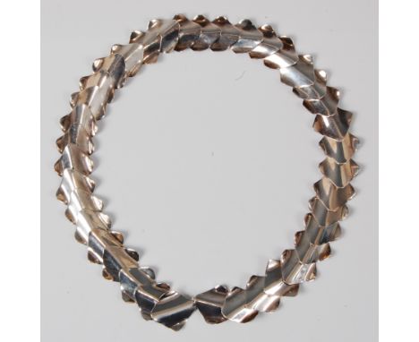 A 1960s sterling silver fancy-link necklace, each link of rounded lozenge and domed flaring form, stamped 925, length 49.5cm