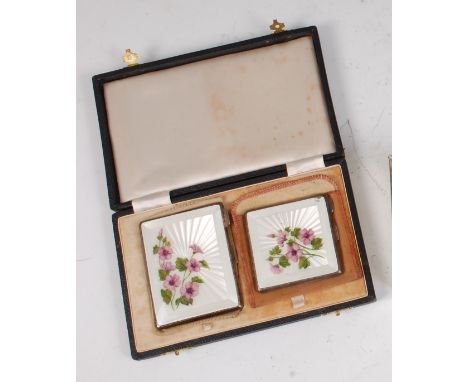 A 1950s silver and guilloche enamelled pocket cigarette case, having stylised floral enamel cover to engine turned back, with