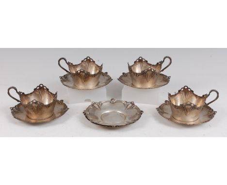 A set of four WMF Art Nouveau white metal teacup holders, dia.9cm; together with a matching set of six WMF white metal saucer