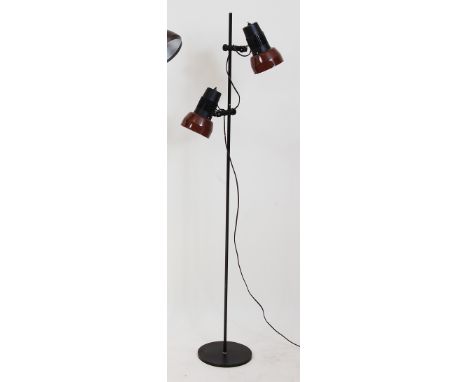 A 1970s Danish twin-light floor lamp, having brown painted dome shades with polypropylene upper attachments, on black painted