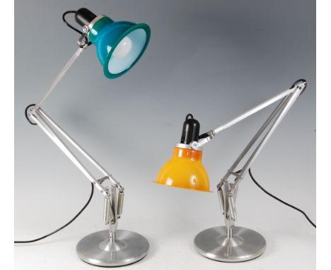 A pair of contemporary brushed aluminium anglepoise lamps, with coloured dome shades, having hinged and rotating action, on c