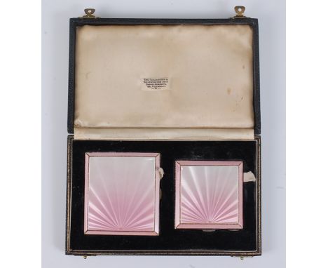 A cased late Art Deco silver and pink guilloche enamel pocket cigarette case, having engine turned and monogrammed back cover