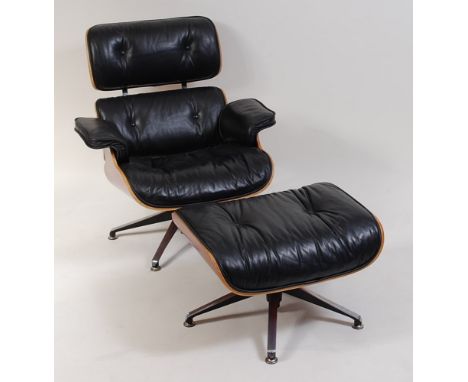 After Charles & Ray Eames - Lounge chair (670) and Ottoman (671) , each black leather button upholstered, with bent ply shell