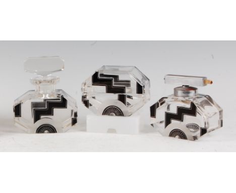 A Czechoslovakian Art Deco heavy lead crystal glass three-piece dressing table set, designed by Karel Palda, comprising perfu