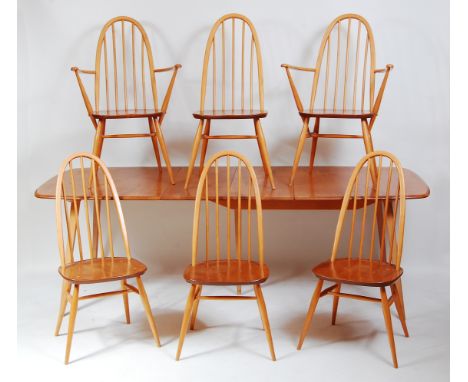 A 1960s Ercol blond elm dining suite, comprising; extending table with pull-out action and drop-in hinged leaf, max. length 2