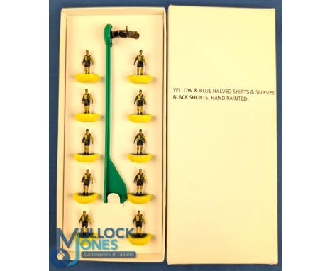 Subbuteo style lightweight Football Team - with strips of yellow and green halved shirts, black shorts - in a non-matching bo