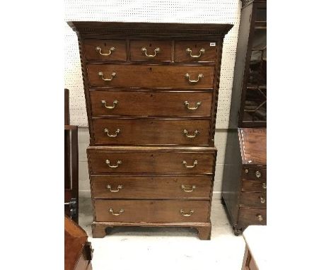 A 19th Century mahogany chest on chest, the upper section with moulded and dentil cornice over three short and three long dra