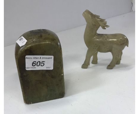 A Chinese pale jade figure of a stag baying, 11.6 cm high by 9 cm long, and a Chinese soapstone seal of block form with carve