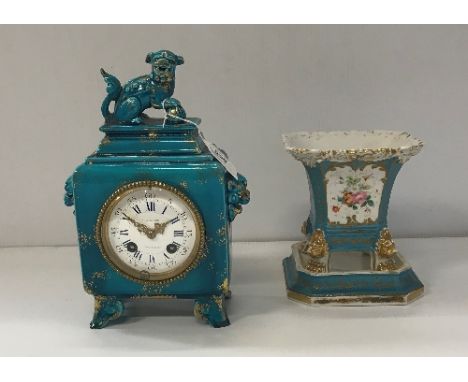 A Japy freres mantle clock in the chinoiserie taste, with dog of Fo finial and two lion head handles, the enamel dial set wit