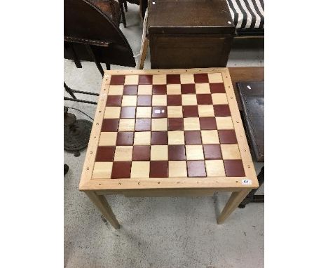 A modern French beech and stained beech chess table, the chequerboard top numbered and lettered over two frieze drawers conta