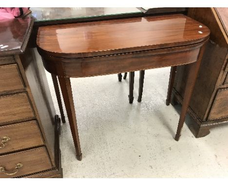 A 19th Century mahogany fold-over card table on square tapered legs to spade feet, 90 cm wide x 74.5 cm high