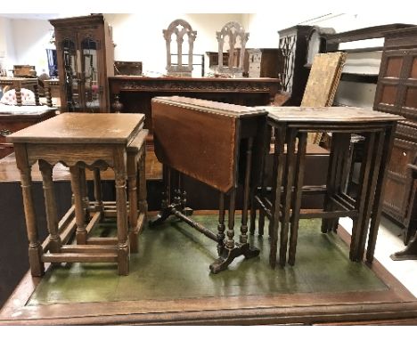 An Edwardian mahogany and inlaid drop-leaf Sutherland table and two oak nests of graduated occasional tables, a light oak sid