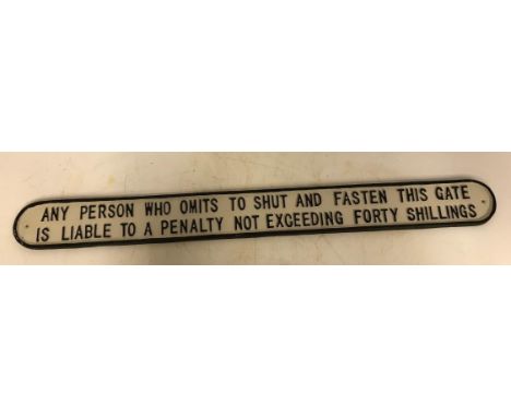 A modern painted cast metal sign "Any Person Who Omits To Shut And Fasten This Gate ......", 83 cm long x 8 cm high
