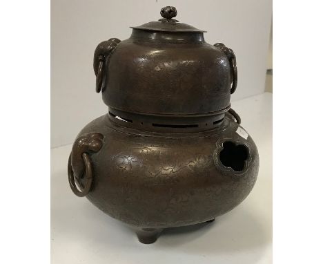 A 19th Century Chinese bronzed copper censer or incense burner, the main body decorated with scrolling foliage flanked by sty