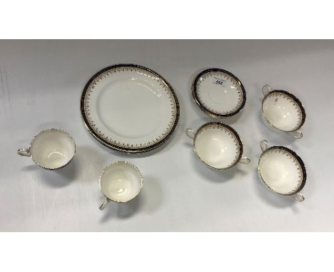 A collection of Aynsley cobalt blue and gilt decorated dinner and tea wares to include coffee cans, soup bowls, plates, etc C