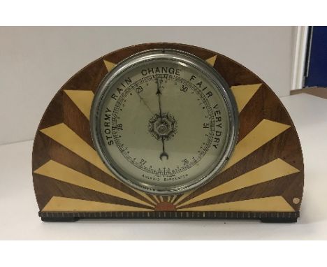 A 1930s Art Deco sunburst framed aneroid barometer, 23 cm high