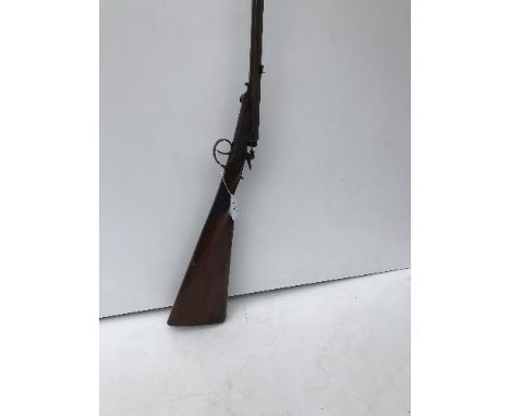 A Victorian single barrel breech loading shotgun, the octagonal Damascus barrel inscribed "Reilly, 205, New Oxford St, London