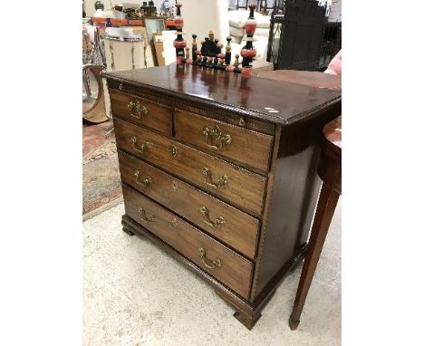 A late George III mahogany bachelor's chest, the top with moulded edge over a brushing slide and two short over three long dr