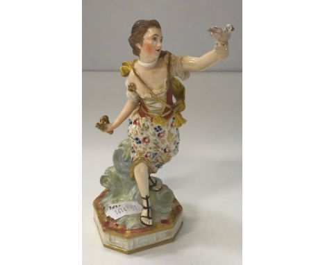 A 19th Century Crown Derby figure of young woman with bugle and bird bearing oxide red crown mark to base No'd 34, 17 cm high