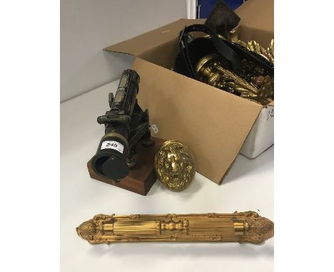 A collection of various brass and other metal wares to include Louis XV style acanthus sabots, a pair of lion mask door handl