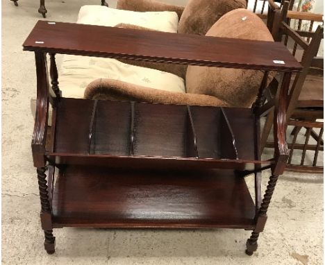 A modern mahogany book table by Aspen Lander of London, the plain top over a five-section trough and single shelf on barley t