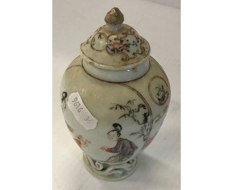 An early 19th Century Chinese vase of ovoid form decorated with panels of two women and child, raised on a scrollwork base wi