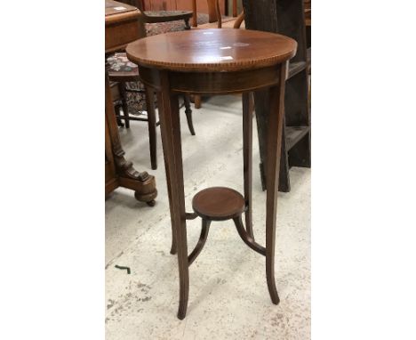 An Edwardian mahogany and inlaid two-tier plant stand, a mahogany scroll arm salon chair, upholstered nursing chair and a but