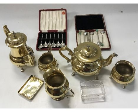 An EPNS four piece tea set with similar jug, a silver mounted Scottish hardstone dirk brooch, a silver lidded dressing table 