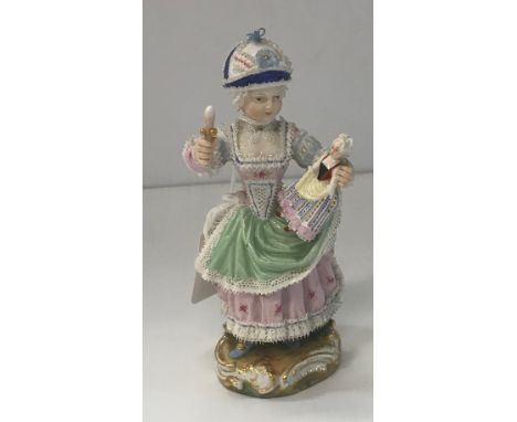 A 19th Century Meissen figure of young girl in lace trimmed dress with doll and rattle No'd 122 to base, 14 cm high CONDITION